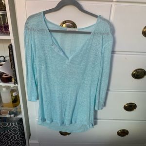light blue top.